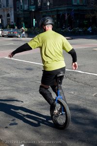 Unicyclist practicing on Washington Street, Hoboken, New Jersey.