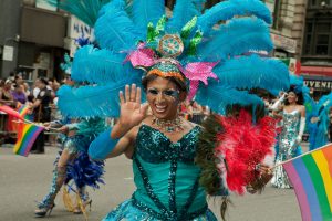 A feathered and costumed participant representing Gay Peruvians of the Americas, in the 2011 Pride Parade on New York's Fifth Avenue.