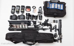 Camera equipment spread out on white