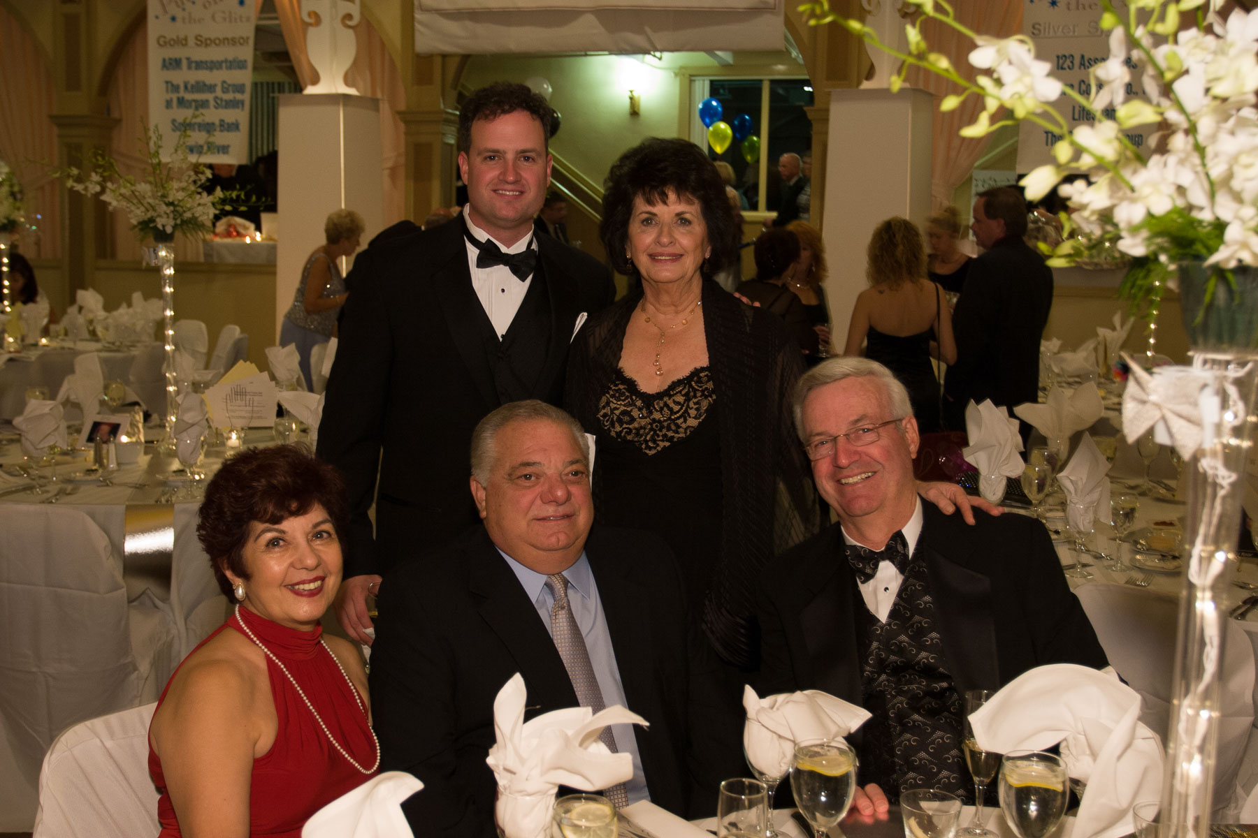 A table of patrons at a gala for the Tomorrow Fund for Children with Cancer