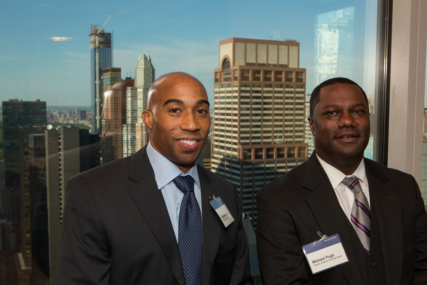 Two Black business executives at a conference.