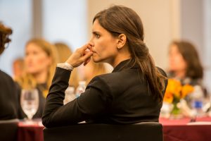 A pensive woman at a business conference