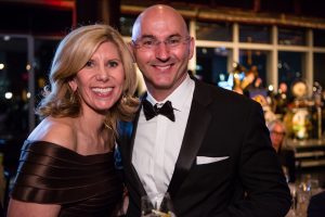 A smiling couple at a gala for the New York Pops.