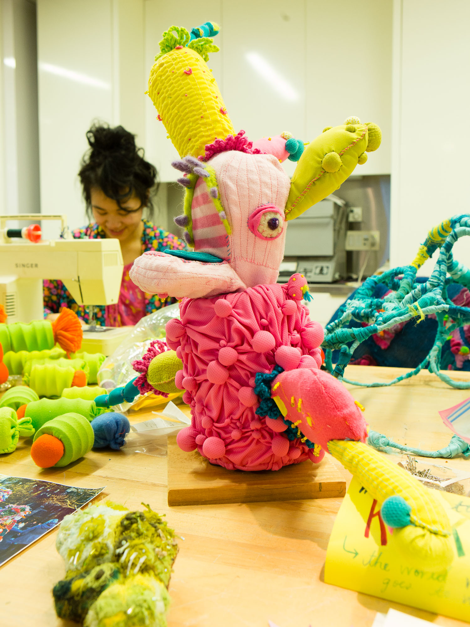 Artist Lexy Ho-Tai at work on her fabric constructions in an open studio in the Museum of Arts and Design.