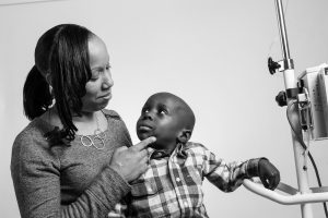 A mother and her child, a cancer patient, photographed for Flashes of Hope