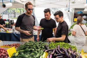 Chefs shop for produce at the Jackson Heights, Queens, green market