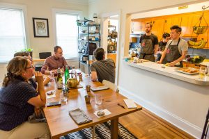 Chefs at a supper club in Jackson Heights, Queens, answer questions from guests