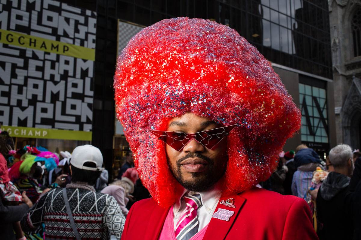 An oversized bright red Afro at the Easter Bonnet Parade and Festival on New York's Fifth Avenue.