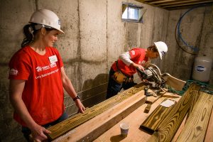 Two women at work for Habitat for Humanity