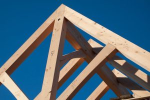 Construction site, post and beam framing detail of a roof peak