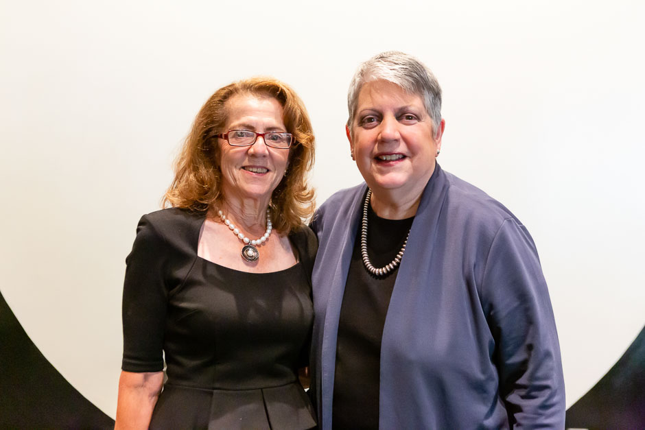 Janet Napolitano and a woman at a conference