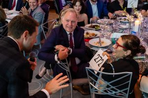 Photo of an auctioneer and successful bidder