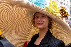 Photo of a woman in a very wide-brimmed straw hat