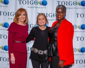 Step-and-repeat photo of Gloria Steinem and 2 other women